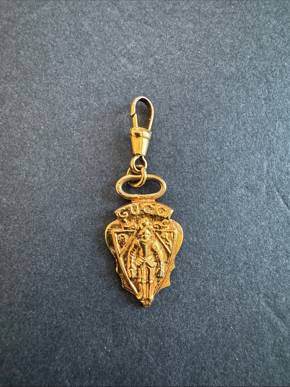 Vintage Gucci Knight Crest Shield Gold-plated charm/pendant from the 1960s